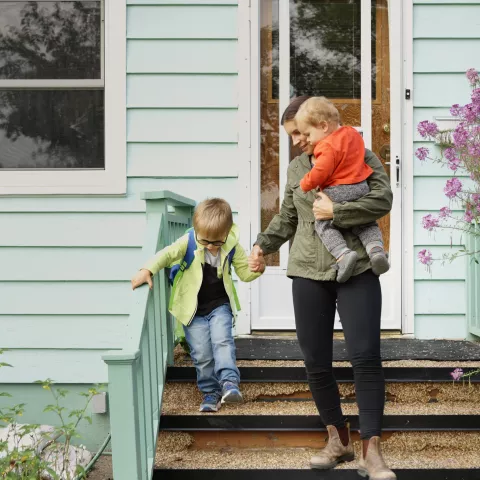 A family leaves their home.