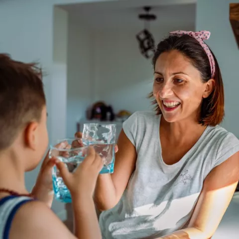 Mother and child drinking water