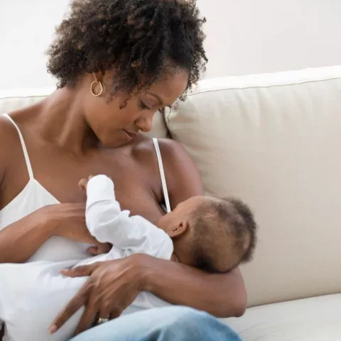 Woman breastfeeding baby