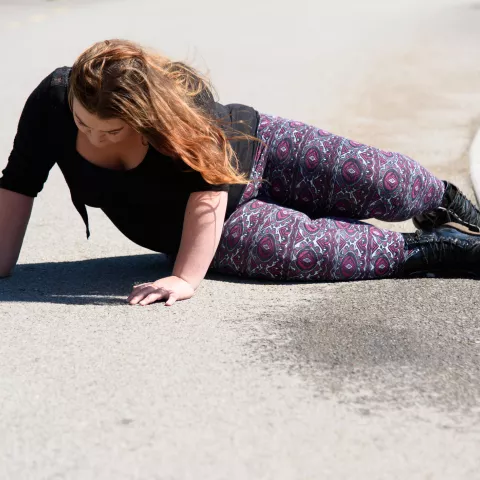 Woman falling on the road