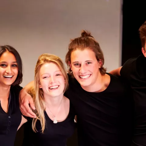 group of girls with arms entwined