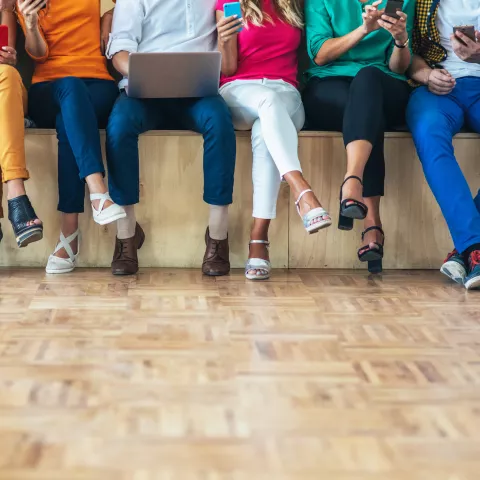 people in filling out survey, reading, surfing the net, using digital devices