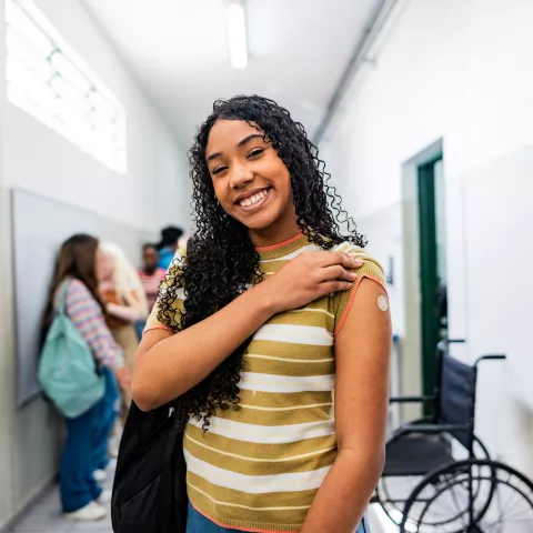 Portrait of a teenager student after taking vaccine at school