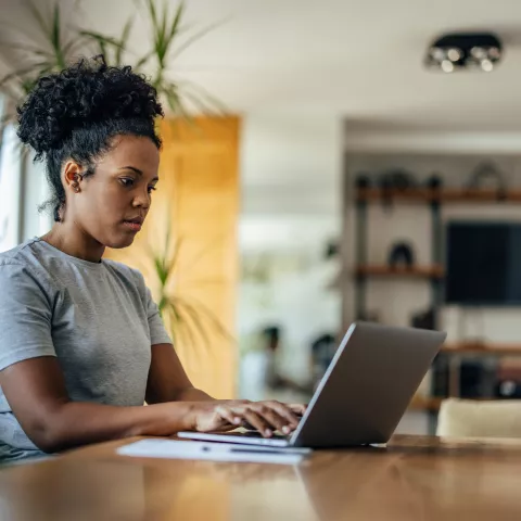 Thoughtful adult woman, browsing the internet