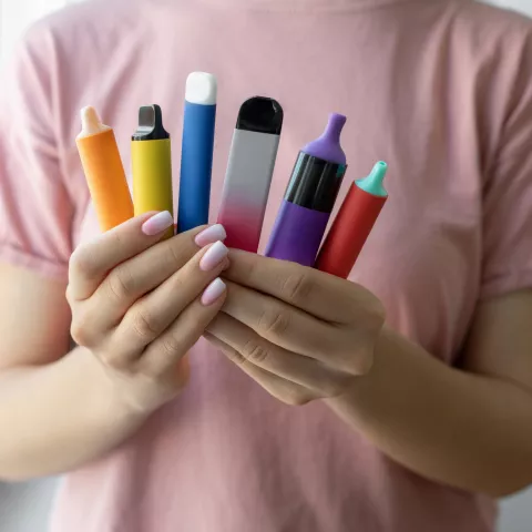 Vape cigarettes in woman hand