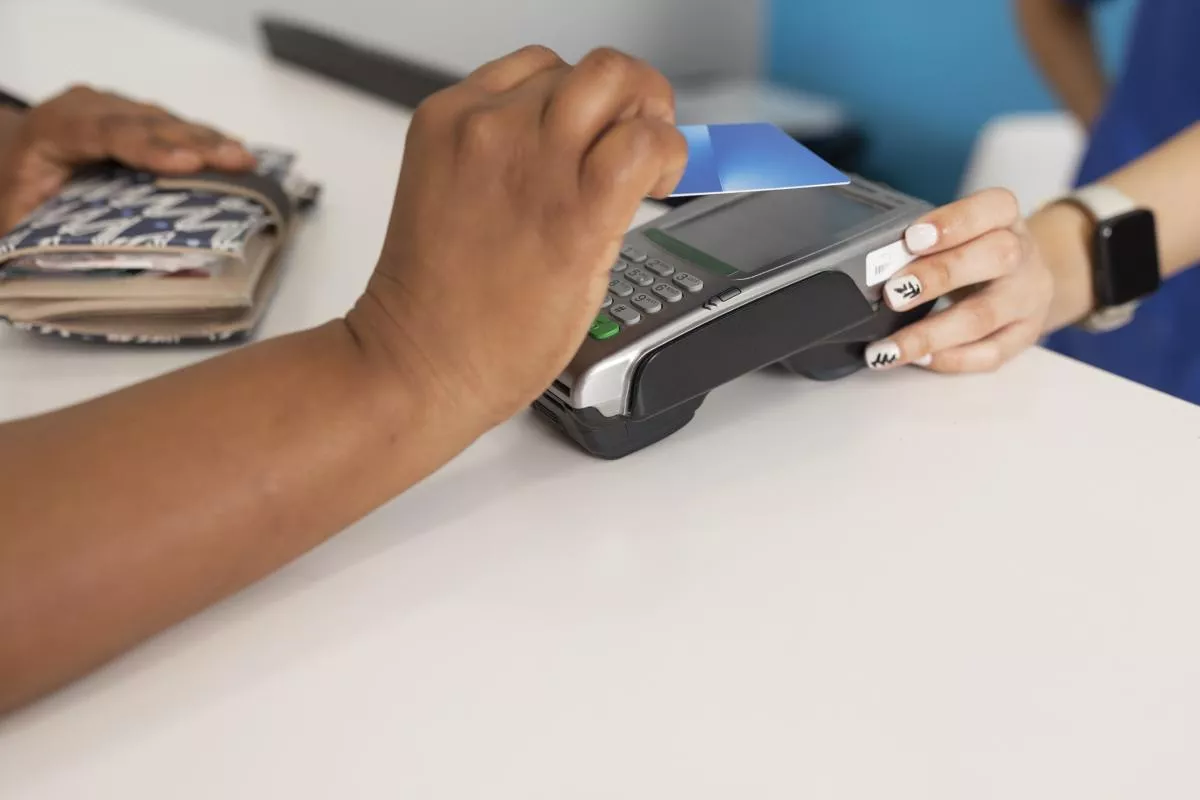 person paying by debit card