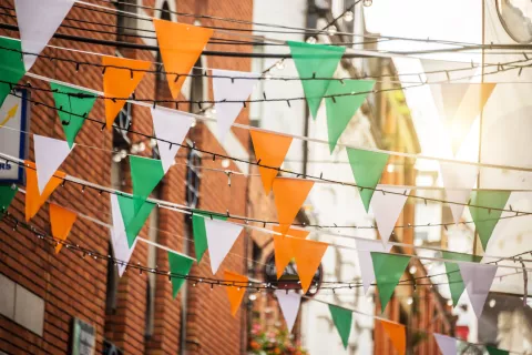Irish flag banners hanging over a street.