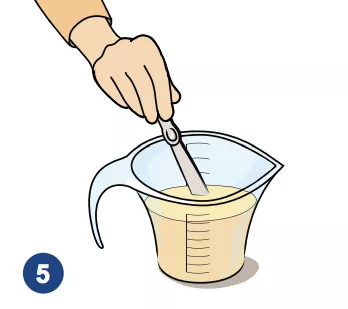 An illustration of a hand mixing a measuring cup of formula with a stirring instrument.