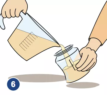 An illustration of mixed formula being poured from a measuring cup into a feeding bottle.