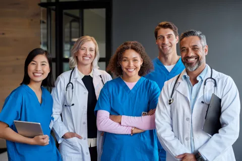 Portrait of happy smiling healthcare team looking at camera