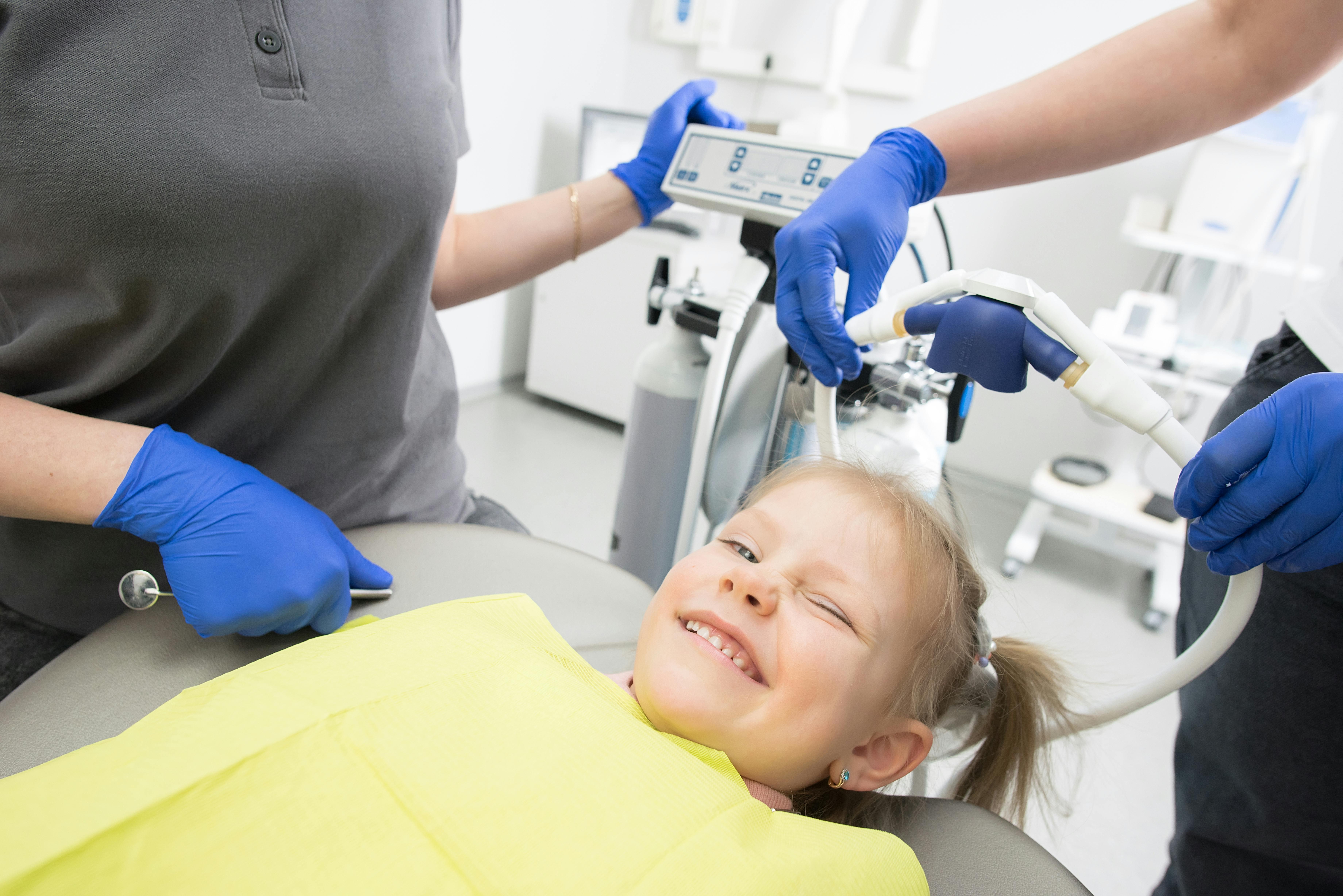 child winking at dentist