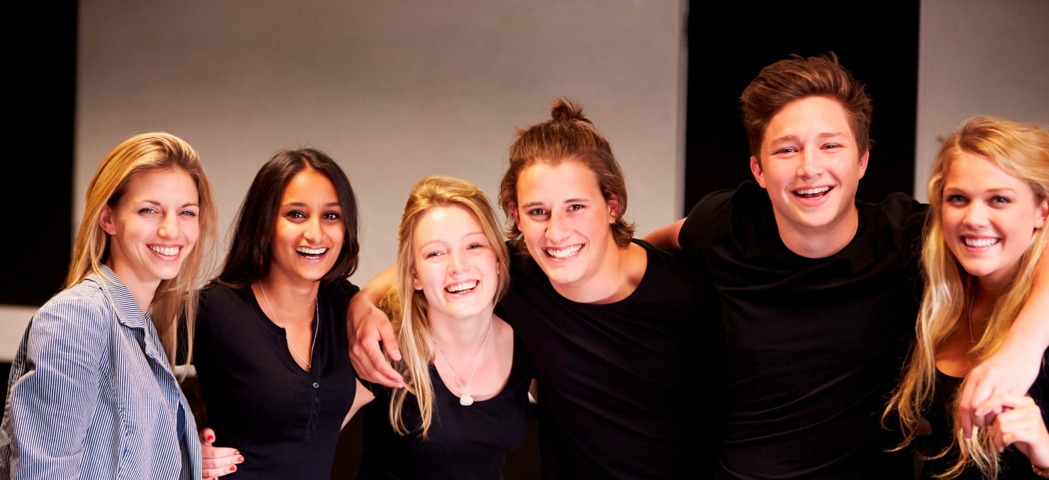 group of girls with arms entwined