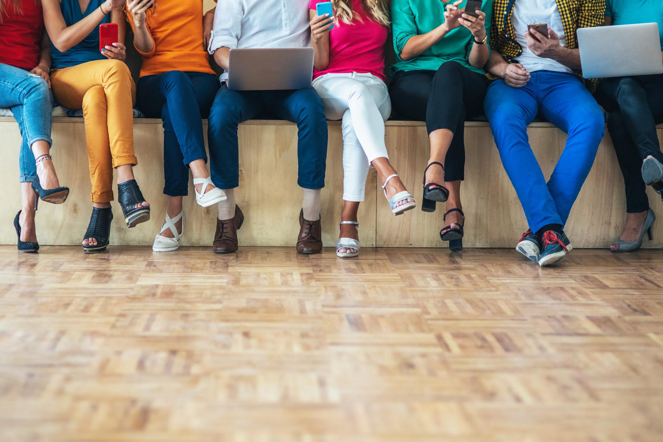 people in filling out survey, reading, surfing the net, using digital devices