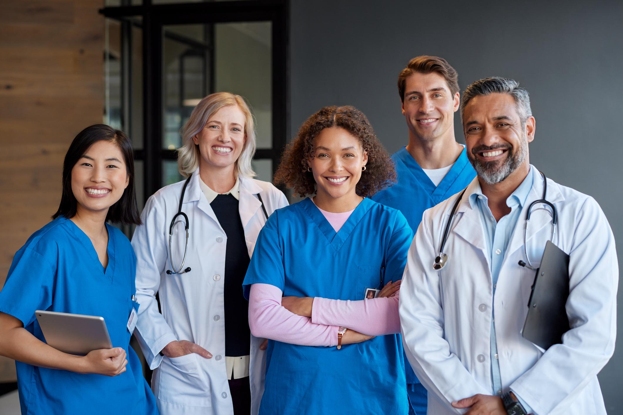 Portrait of happy smiling healthcare team looking at camera