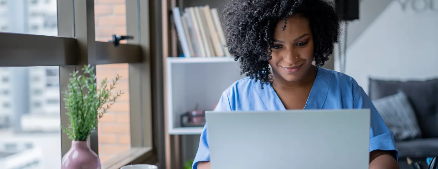 Nurse on computer in office