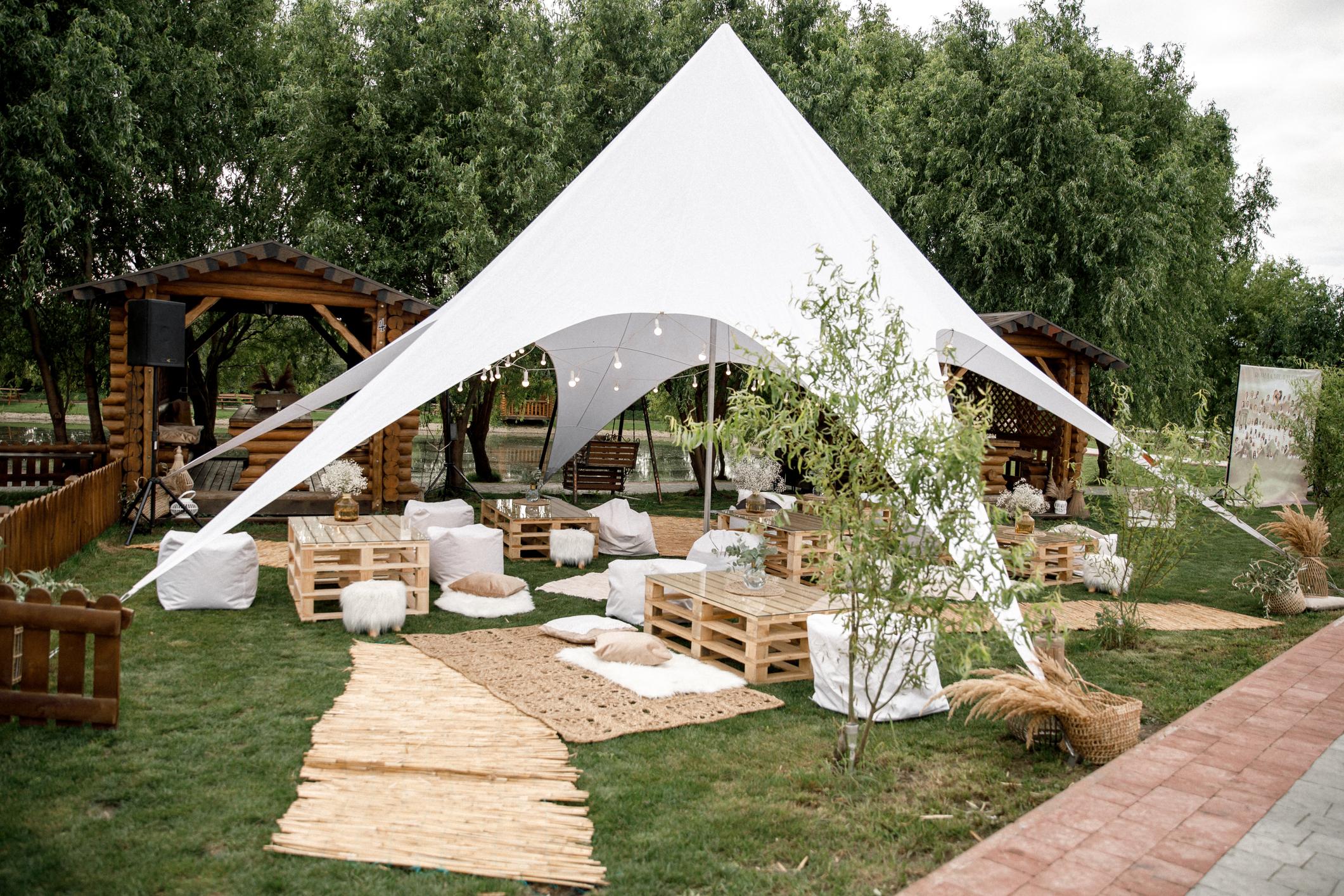 Spacious tent in the garden for a spa event