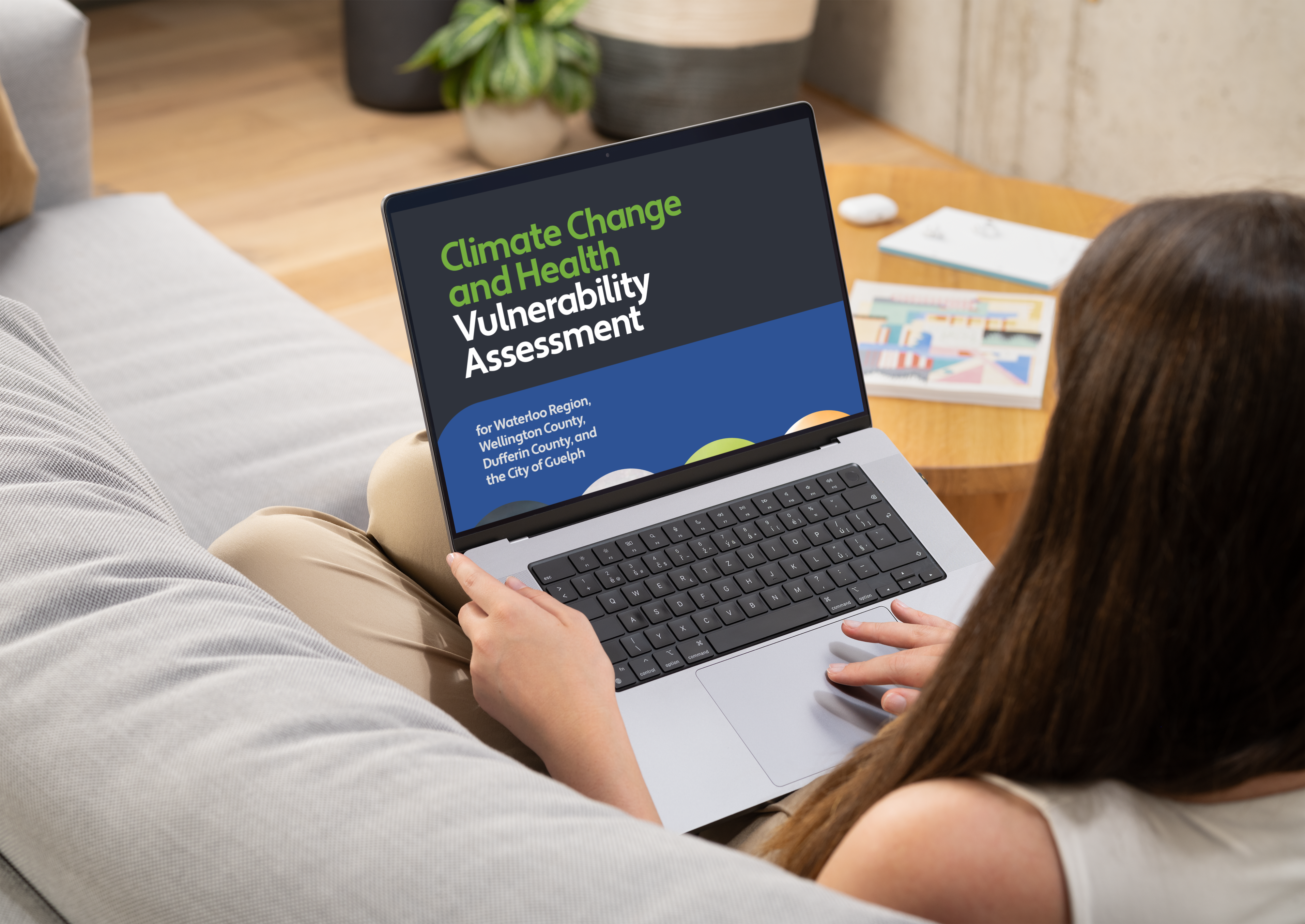 Woman viewing climate change report on laptop