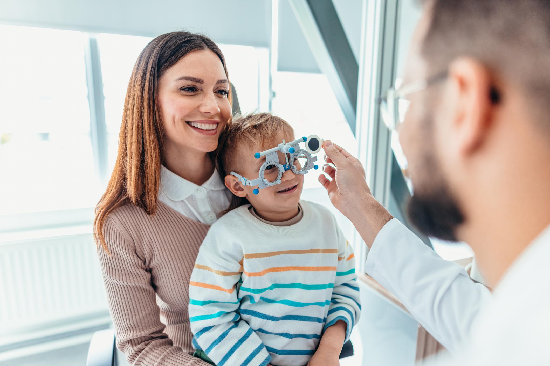 Mother and Child at Eye Appointment with an Optometrist