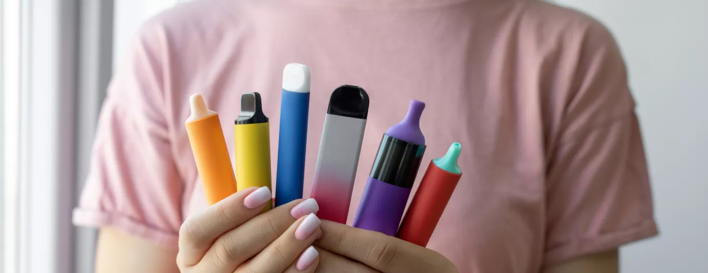 Vape cigarettes in woman hand