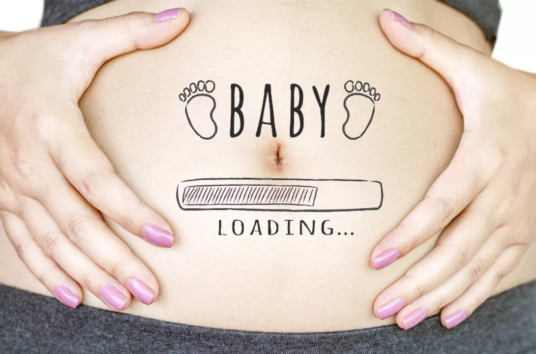 a pregnant person holding their tummy. On the tummy the words "Baby loading..." is written with a computer loading image