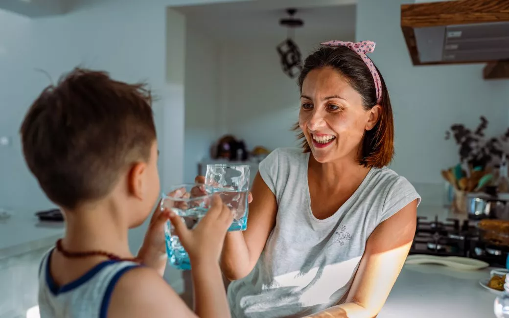 Mother and child drinking water