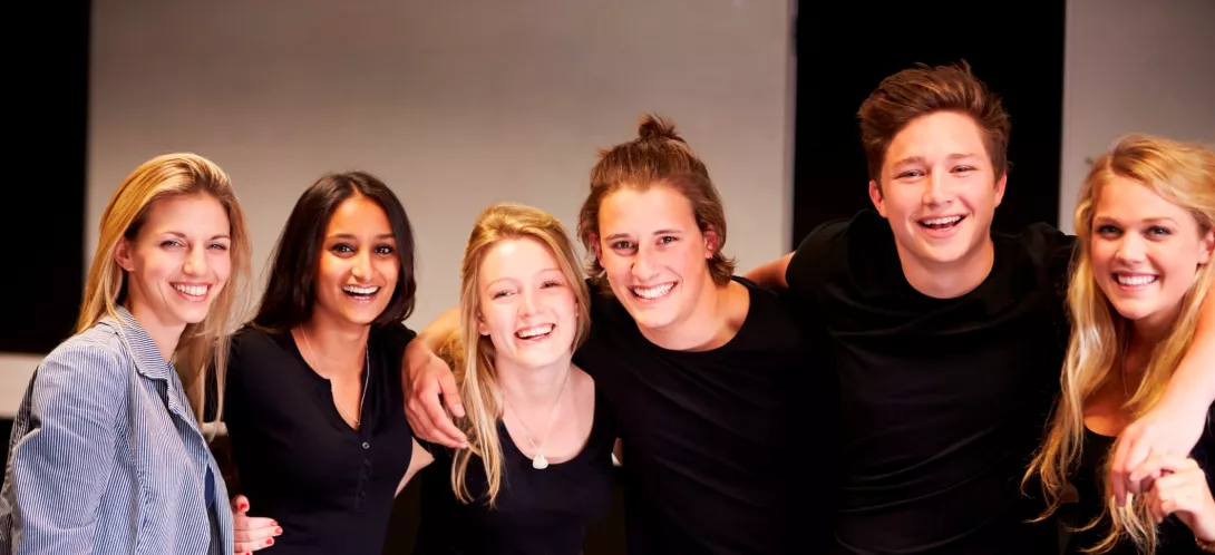 group of girls with arms entwined