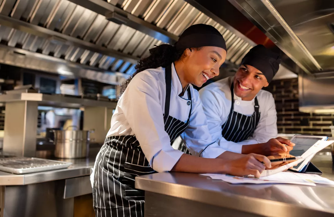 Team of chefs doing paperwork at a restaurant